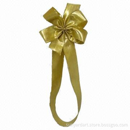 Metallic ribbon bow with adhesive tab at back